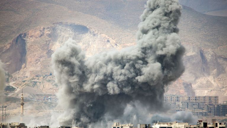 Smoke billows from the Jobar district in Damascus on Monday