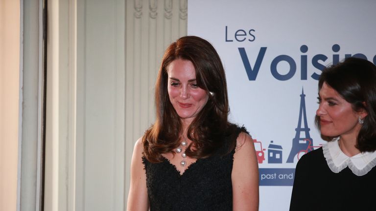 She wore a chic sleeveless black outfit by Alexander McQueen before changing into the glittering gown for the dinner at the British ambassador's residence

