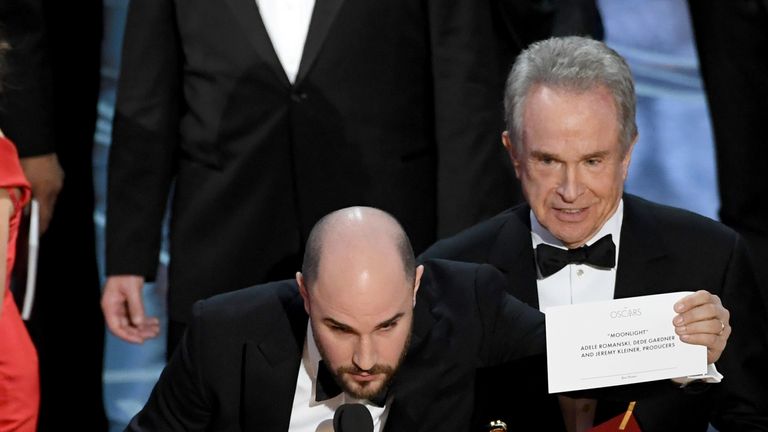La La Land producer Jordan Horowitz holds up Moonlight as the best picture winner