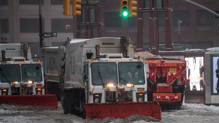Snow plows go through New York City as Storm Stella brought blizzard conditions to the US East Coast