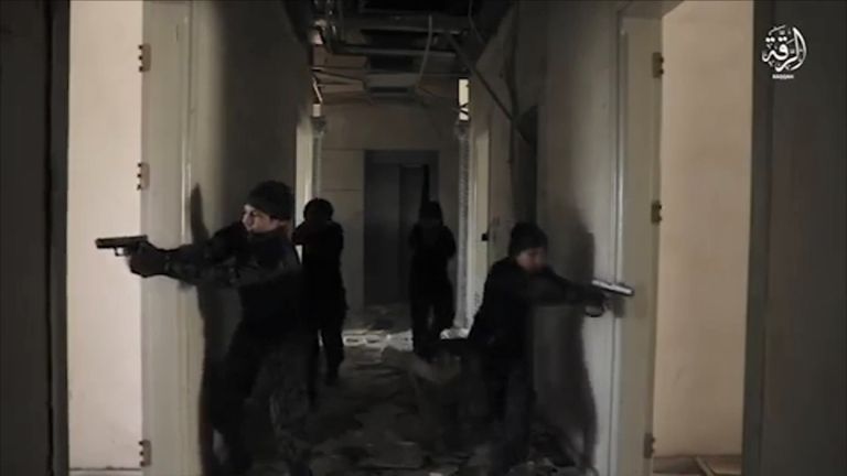 The propaganda video shows the armed, masked boys dressed in combat fatigues