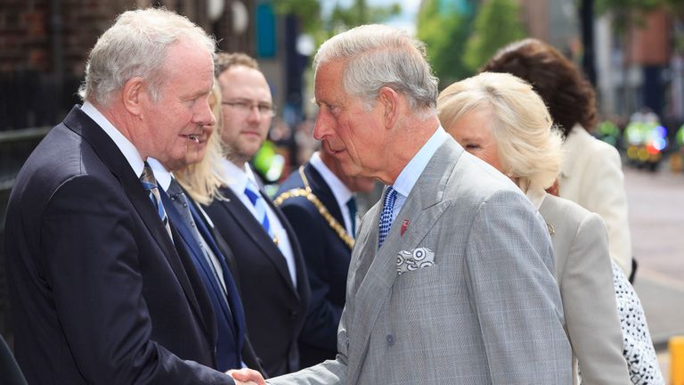 The Prince of Wales shakes hands with Northern Ireland&#39;s Deputy First Minister Martin McGuinness outside St Patrick&#39;s Church in Belfast, 2015
