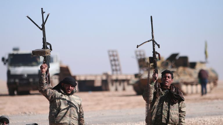 Syrian Democratic Forces soldiers gesture as they close in on the IS stronghold of Raqqa