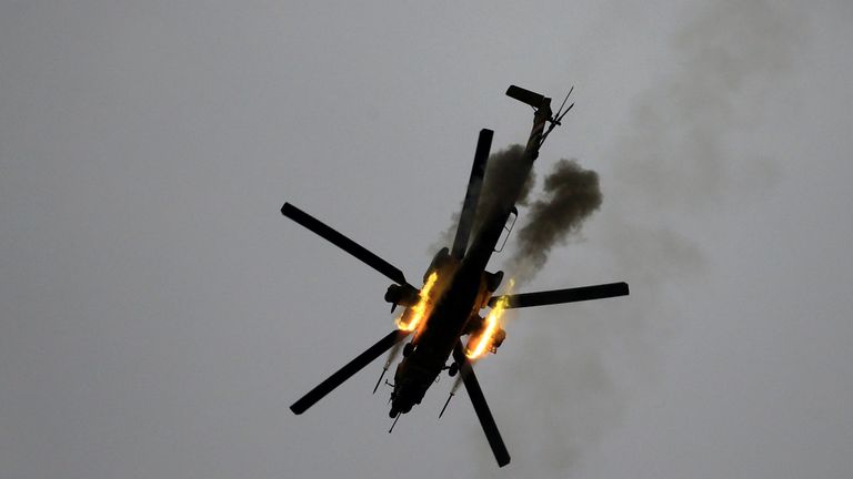 An Iraqi Air Force helicopter fires missiles against Islamic State militants 