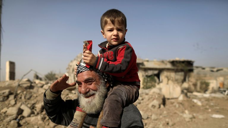 Displaced people flee their homes, while Iraqi forces battle with Islamic State militants, in western Mosul, Iraq March 12, 2017