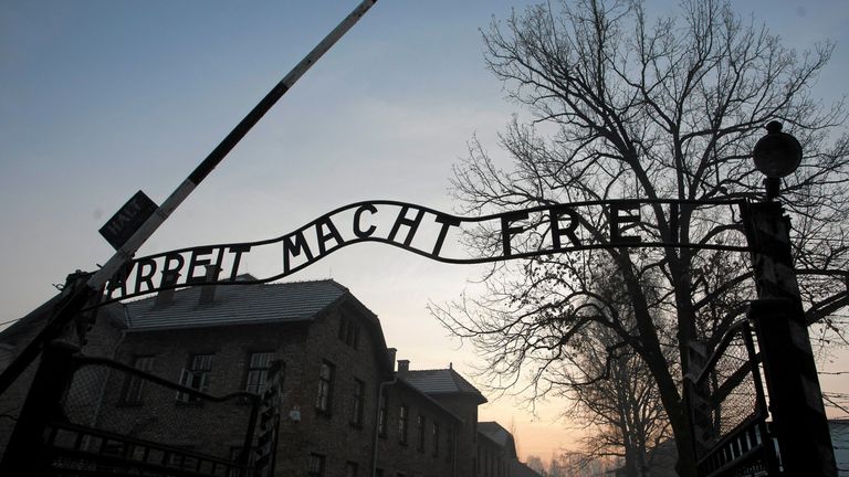 The group slaughtered a sheep in front of the main entrance to the Auschwitz camp