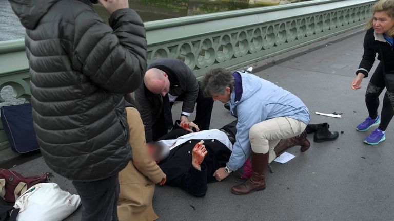 Injured people are assisted after an incident on Westminster Bridge 