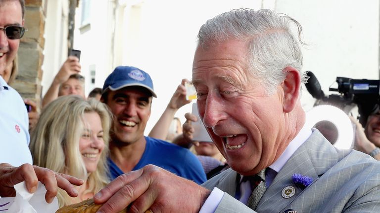 Prince Charles, Prince of Wales (known as the Duke of Cornwall in Cornwall) is given a Cornish Pasty as he visits Nicki&#39;s Bakery on July 19, 2016 in Port Isaac, England