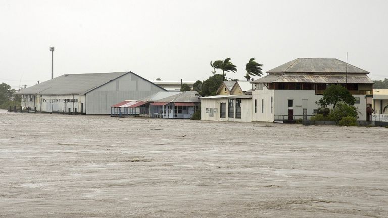Buildings near the flooded Pioneer River in Mackay 