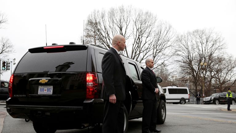 Secret Service agents stand by the Presidential vehicle during Mr Trump&#39;s inauguration on 20 January