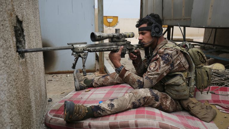 An Iraqi army sniper takes aim during the advance on Mosul&#39;s Old City