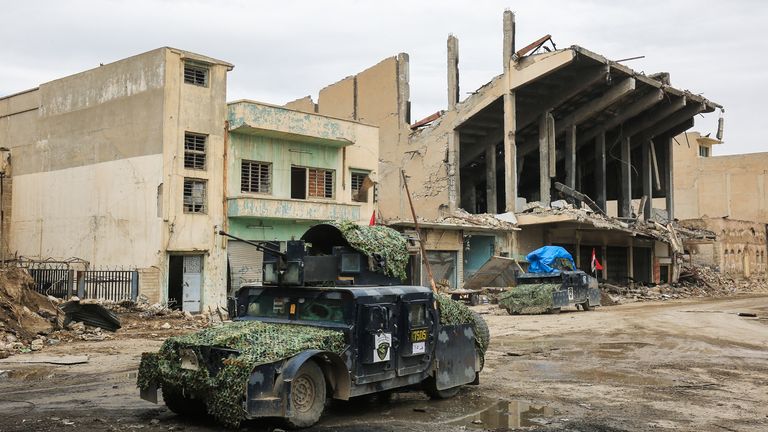 An armoured vehicle of the Iraqi counter-terrorism service (CTS) advances in al-Dawasah neighbourhood in west Mosul