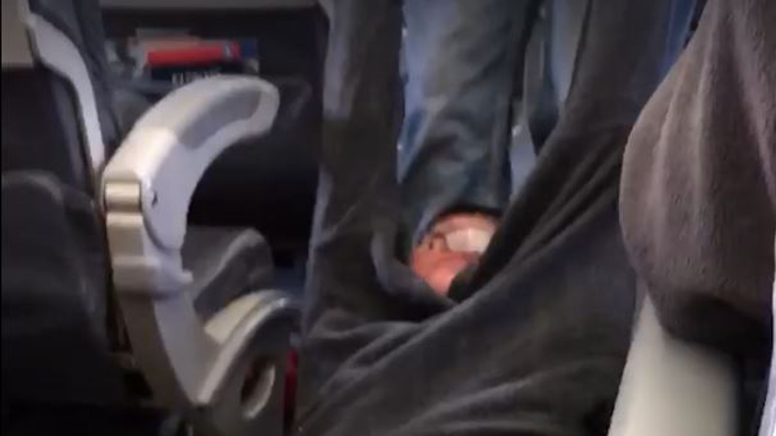 Watch eyewitness describe moment bloodied man was dragged off United ...