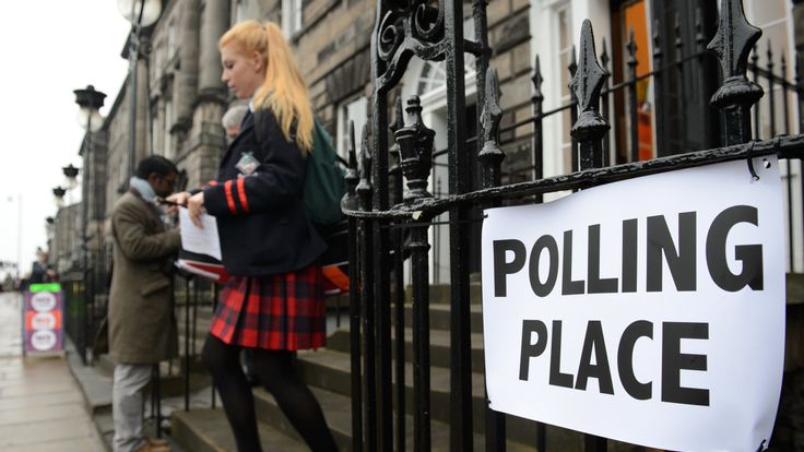 A young voter leaves a polling station after casting her vote in Edinburgh, Scotland, on September 18, 2014, during a referendum on Scotland's independence