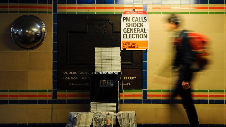 A newspaper banner announces that Theresa May has called a General Election