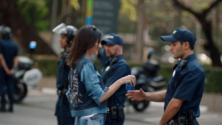 Kendall Jenner hands a police officer a Pepsi. Pic: Pepsi advert