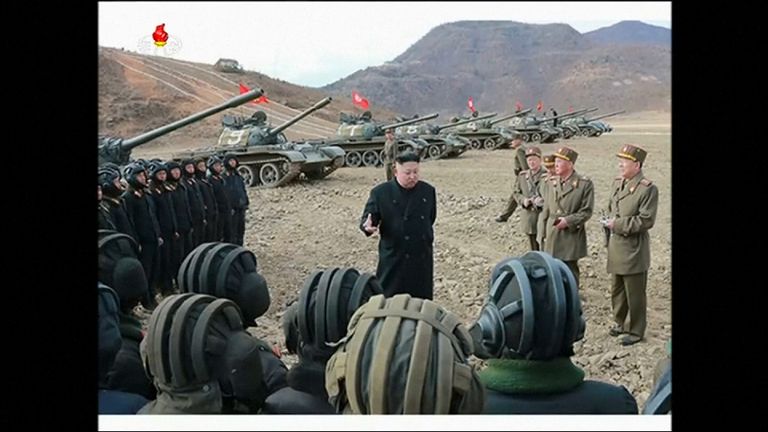 The North Korean leader talks to officers
