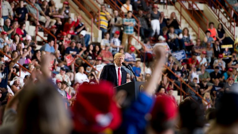 US President Donald Trump (C) addresses a &#39;Make America Great Again&#39; rally in Harrisburg, PA, April 29, 2017, marking his 100th day in office