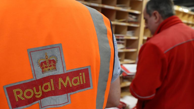 File photo dated 15/12/16 of a Royal Mail worker at a sorting office.