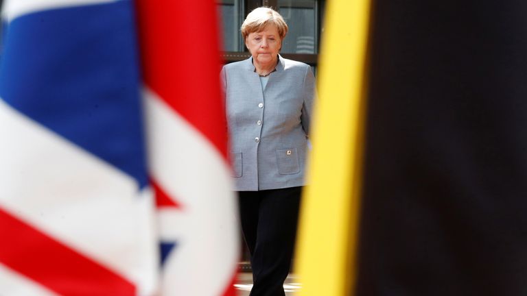 German Chancellor Angela Merkel walks past the Union Jack flag as she arrives at the EU summit in Brussels, Belgium, April 29, 2017
