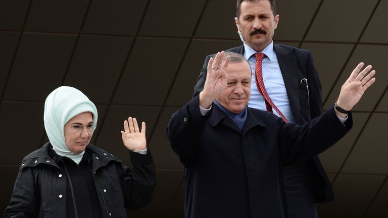 Recep Tayyip Erdogan and his wife Emine greet supporters at Ankara Esenboga Airport