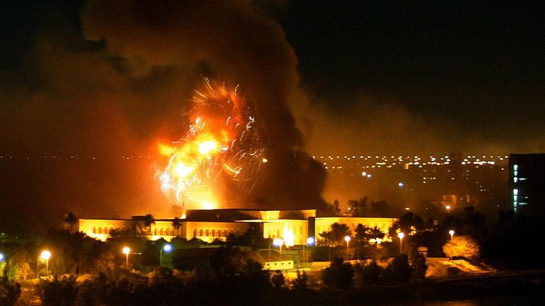 Smoke covers the presidential palace compound during a massive US-led air raid in Baghdad 21 March 2003