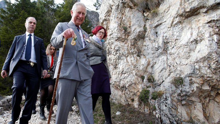 Prince Charles walks as he visits the Path of 52 Tunnels in the mountains created by the Italian military during the First World War at Bochetta di Campiglia near Vicenza