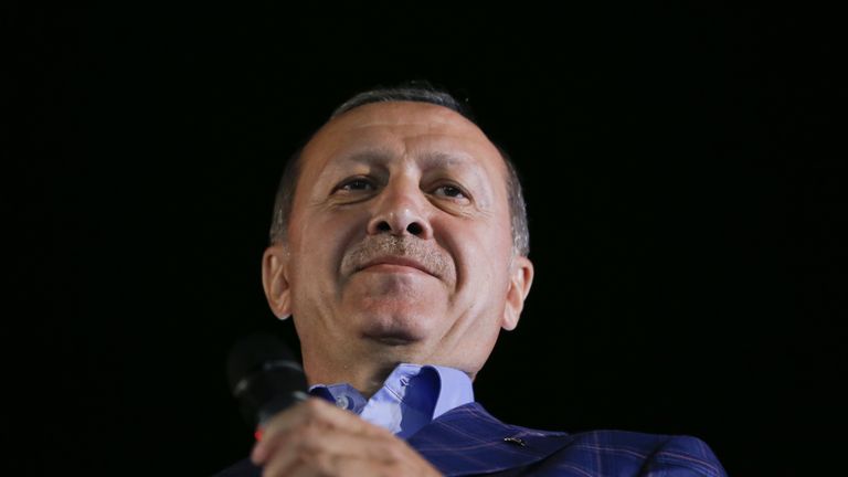 Turkish President Recep Tayyip Erdogan greets his supporters in Istanbul