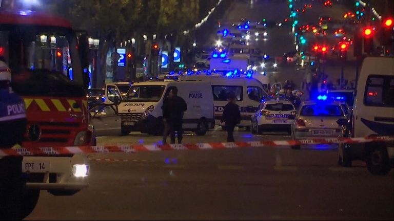 Emergency services respond after a policeman is shoot dead in Paris