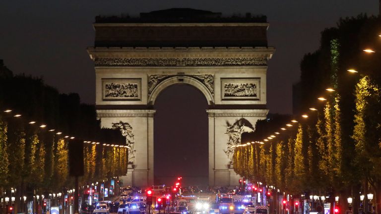Police vehicles seen on the Champs-Elysees, near the Arc de Tiomphe