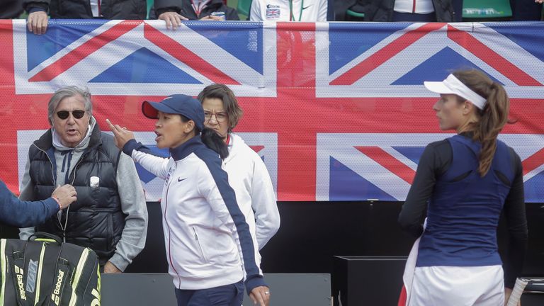 Great Britain&#39;s head coach Anne Keothavong gestures towards Romania&#39;s head coach Ilie Nastase during the FedCup Group II play-off match between Romania and Great Britain