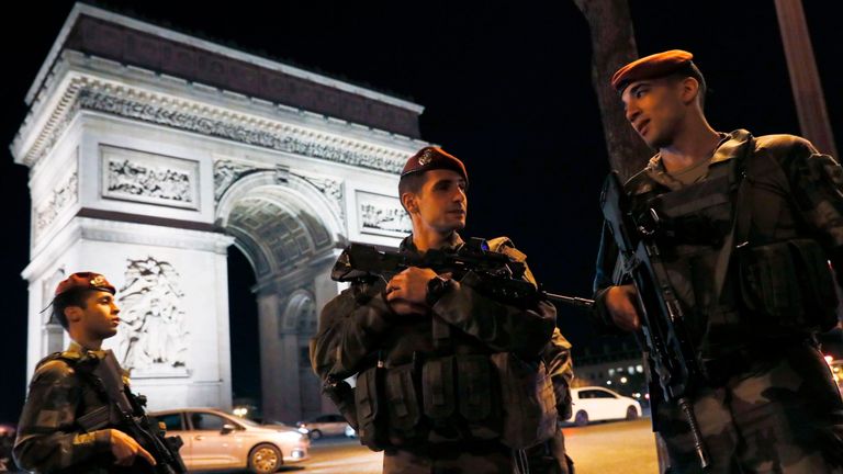 French soldiers stand guard at the Arc de Triomphe near the Champs Elysees in Paris after a shooting on April 20, 2017