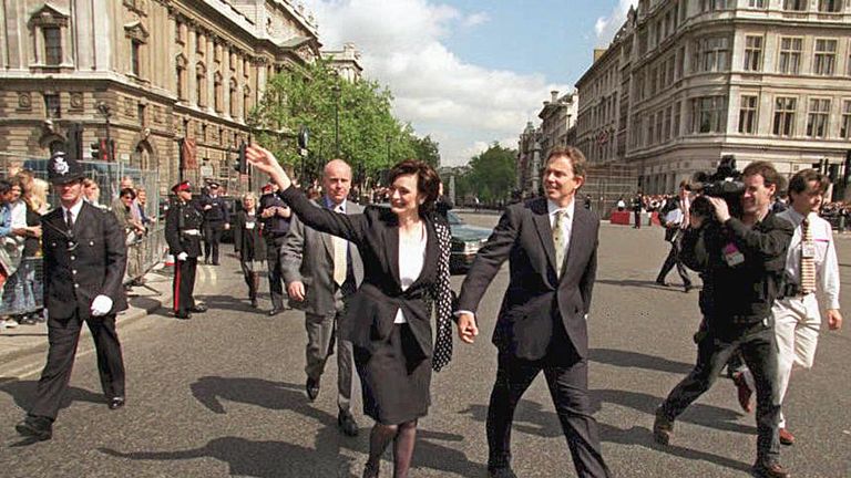 Tony Blair walks with his wife Cherie as they leave Downing Street on their way to the Palace of Westminster for the State Opening of Parliament 