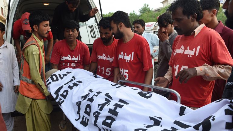 The body of a criminal convicted in Pakistan is moved after his execution