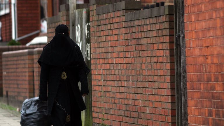 A Muslim woman wearing a traditional burka in Birmingham