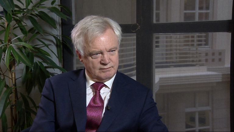 Brexit Secretary David Davis being interviewed in room.