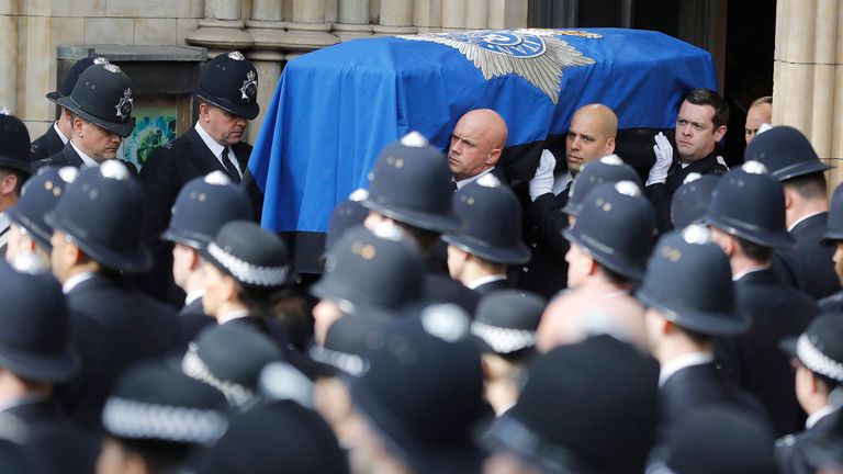 Pallbearer&#39;s carry PC Keith Palmer&#39;s coffin out of Southwark Cathedral following his funeral