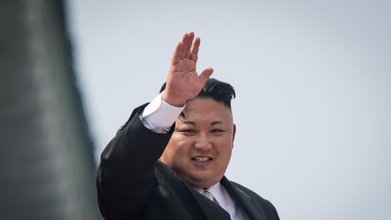 Kim Jong-un waves to crowds at a military parade in Pyongyang on 15 April 2017