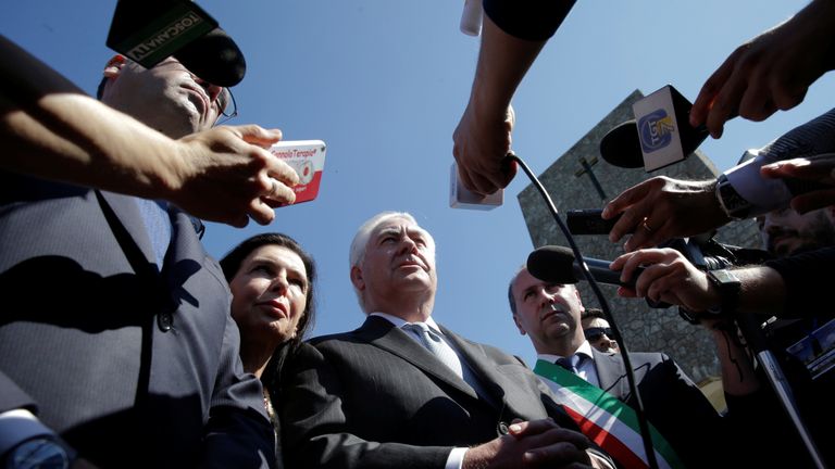 Rex Tillerson talks to reporters during a ceremony at the Sant'Anna di Stazzema memorial in Tuscany