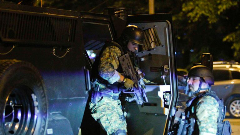 Macedonian riot police block the road near the parliament