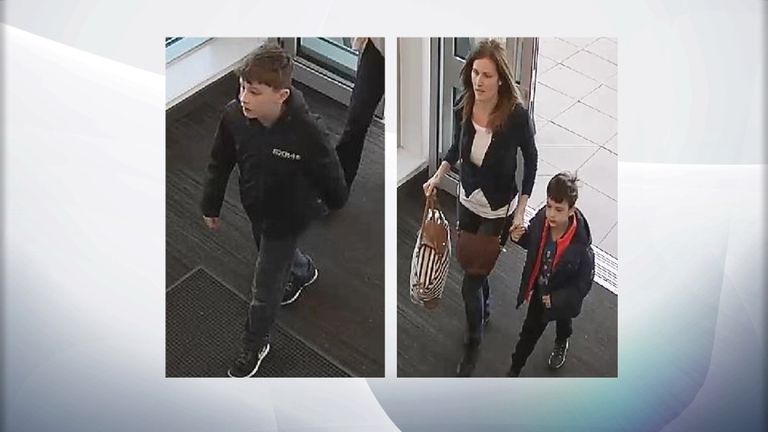 Police-issued CCTV images show Louis Madge (L) and his mother Samantha Baldwin holding hands with his brother Dylan
