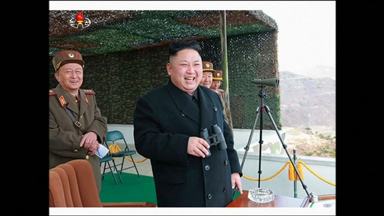 Kim Jong-Un laughs with his generals as the competition unfurls