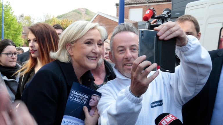 Marine Le Pen and a voter take a selfie on the campaign trail in Rouvroy