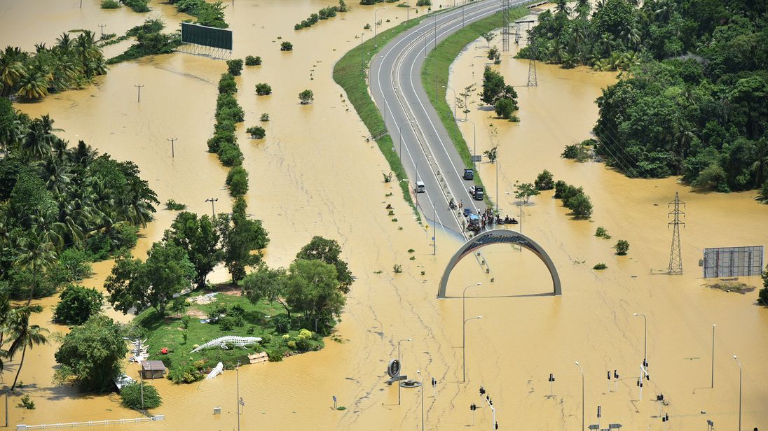 A part of a flooded highway exit is seen in a village in Matara