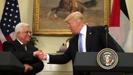 US President Donald Trump shakes hands with Palestinian President Mahmoud Abbas
