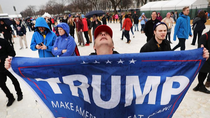 WASHINGTON, DC - JANUARY 20: US President Donald Trump supporters react on the National Mall to the inauguration of US President Donald Trump on January 20, 2017