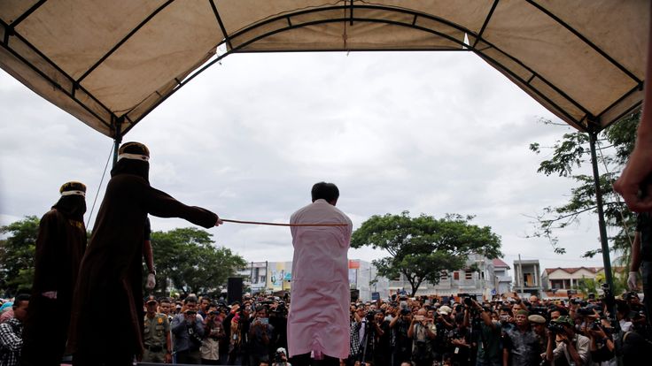 A gay man is caned in Indonesia