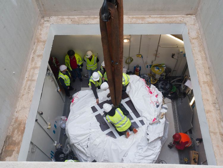 Engineers work on the installation