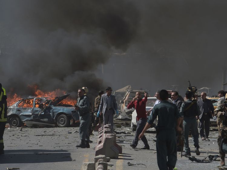 Security forces try to move civilians away from the blast zone