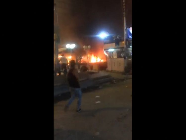 A fire rages after a car bombing in Baghdad on 30 May, 2017